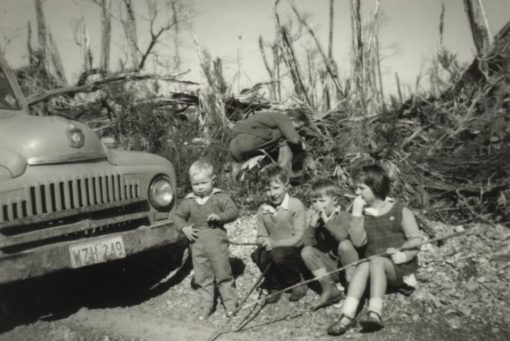 Vicki, her father and brothers at Henty River